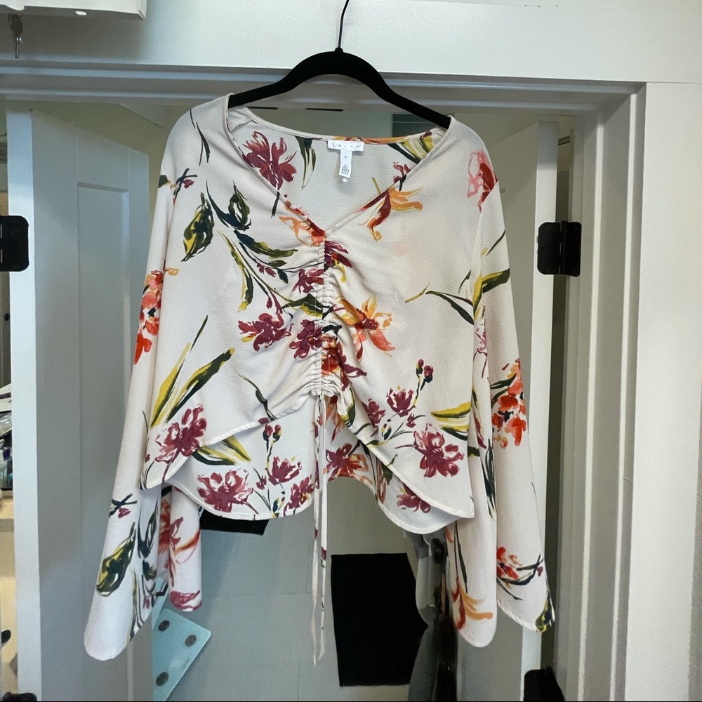 Leith floral top with bell arms.